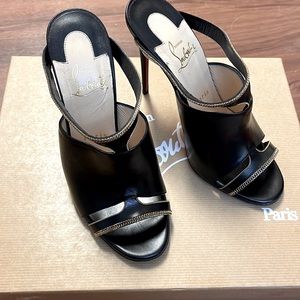 6 and a half almost like new black Christian louboutin with gold accents